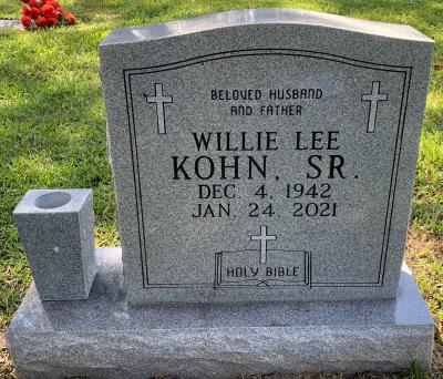 stand up headstone with cross and bible emblems
